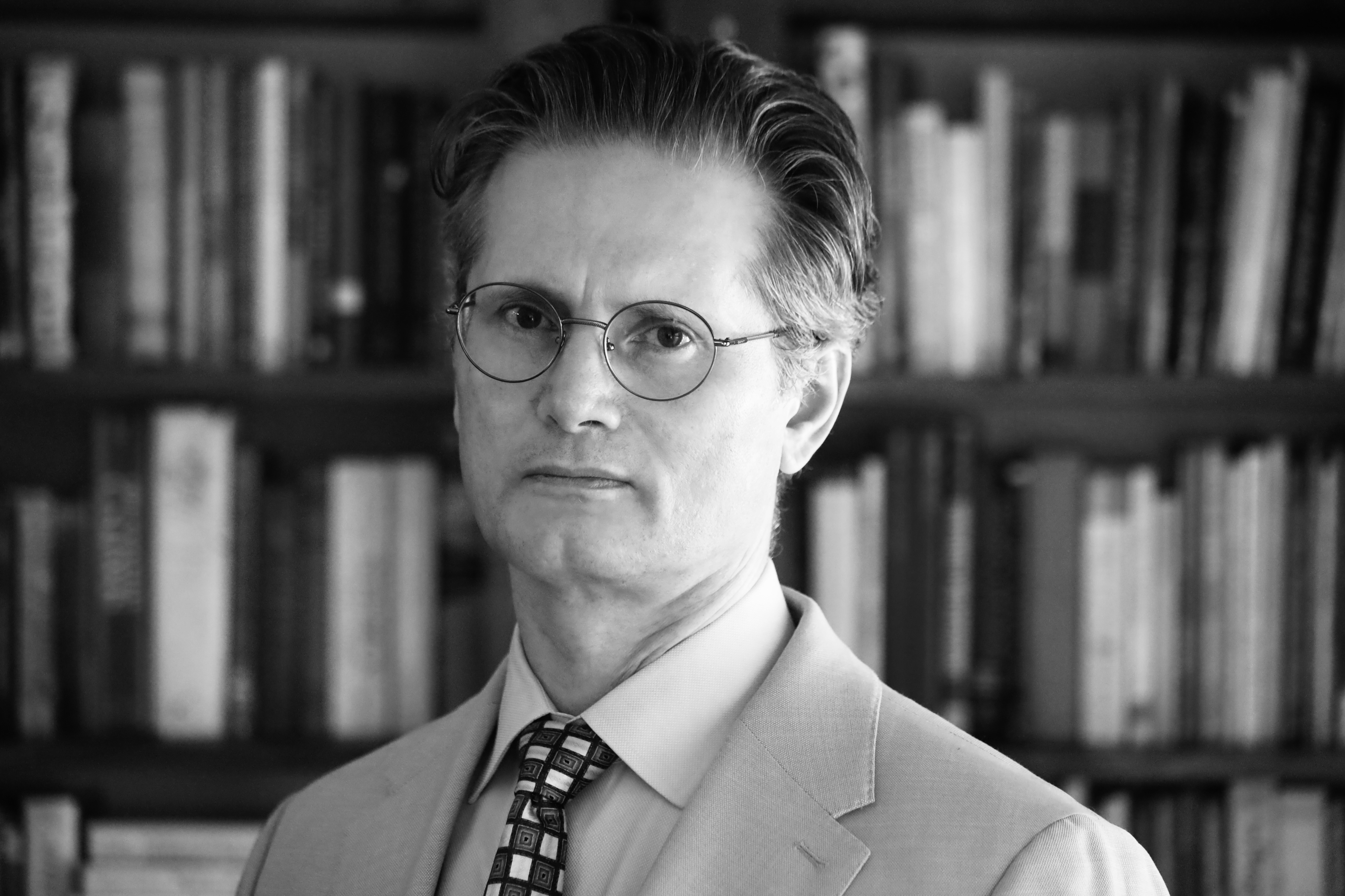 Daniel E. Holloway in a warm office setting